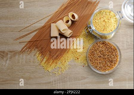 The Sardinian fregola is a shape of wheat pasta, in the shape of a ball.Here with different types of short and long pasta. Stock Photo