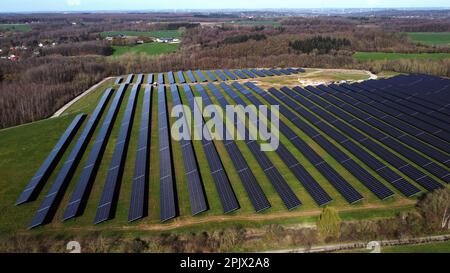 Aerial view of the largest Walloon solar panel installation, in Braine l'Alleud, Tuesday 04 April 2023. The municipality of Braine-l'Alleud inaugurated a field of photovoltaic panels of 19 hectares, designed by the municipal authorities and located in an old sand pit. Nearly 18,500 south-facing two-sided photovoltaic panels will provide up to 40 million kWh each year - i.e. the annual consumption of 4,000 households - and the electricity will arrive directly on the site of the UCB company, located at a few hundred meters. BELGA PHOTO ERIC LALMAND Credit: Belga News Agency/Alamy Live News Stock Photo