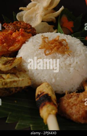 The typical dish of Balinese cuisine Nasi Champur (Mixed Rice), Ubud, Bali. Stock Photo