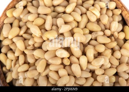 Close-up top view of peeled pine nuts. Pine nut seeds. Stock Photo