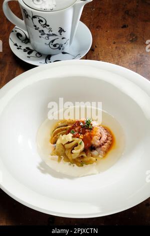 Octopus and cuttlefish with wild herb broth by Chef Ciccio Sultano of the Duomo restaurant, with two Michelin stars, is one of the most representative Stock Photo