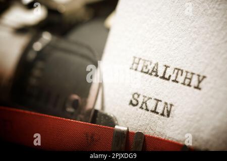 Healthy skin text written with a typewriter. Stock Photo