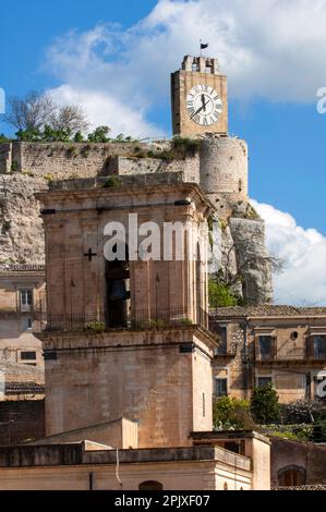 view on the bell tower of the Cathedral of San Pietro and the Castello dei Conti, city of Modica, Ragusa, Sicily, Italy, Europe; UNESCO World Heritage Stock Photo