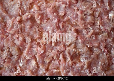 Background of meat in a pie. Minced meat close-up. Fresh meat. Raw minced meat. Stock Photo