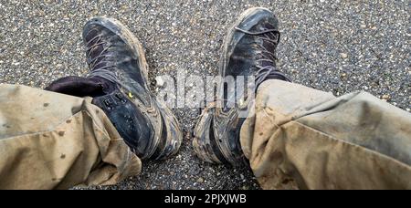 Dirty shoes and trousers of a mountain hiker, Saint-Pierre de Chartreuse, Isere, France Stock Photo
