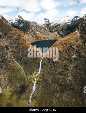 Amazing aerial view of mountain Lake Quill and Sutherland Falls on the scenic flight from Milford Sound to Queenstown, Fiordland, New Zealand Stock Photo