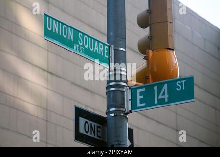 Green East 14th Street and Union Square traditional sign in Midtown Manhattan in New York City Stock Photo