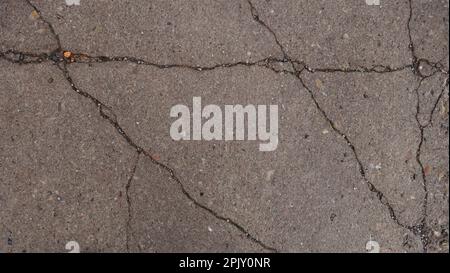 cracked wall or pavement Stock Photo
