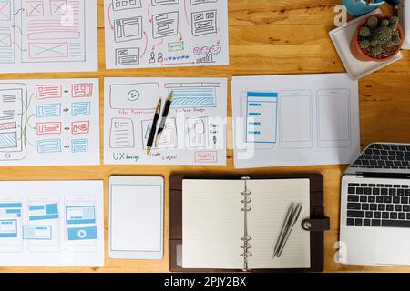 Top view of Creative flat lay UX designer working space and office supplies. Smartphone application layout prototype project. Stock Photo