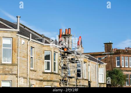 Builders repairing a roof on a terraced house, Scotland, UK, Europe Stock Photo
