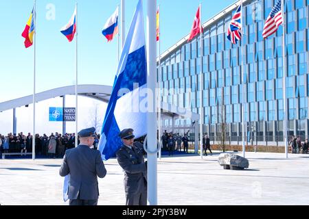 Brussels, Belgium. 04th Apr, 2023. Finnish military personnel install the Finnish national flag at the NATO Headquarters in Brussels, Belgium on April 04, 2023. Credit: ALEXANDROS MICHAILIDIS/Alamy Live News Stock Photo