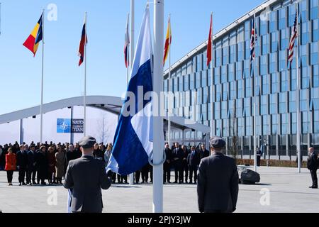 Brussels, Belgium. 04th Apr, 2023. Finnish military personnel install the Finnish national flag at the NATO Headquarters in Brussels, Belgium on April 04, 2023. Credit: ALEXANDROS MICHAILIDIS/Alamy Live News Stock Photo