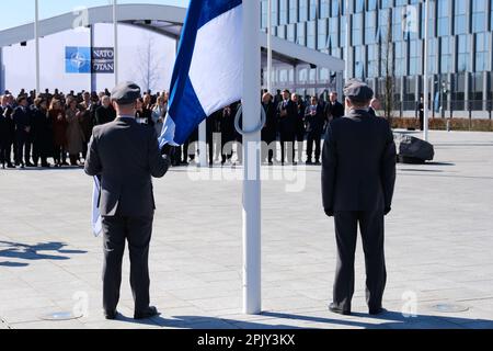 Brussels, Belgium. 04th Apr, 2023. Finnish military personnel install the Finnish national flag at the NATO Headquarters in Brussels, Belgium on April 04, 2023. Credit: ALEXANDROS MICHAILIDIS/Alamy Live News Stock Photo