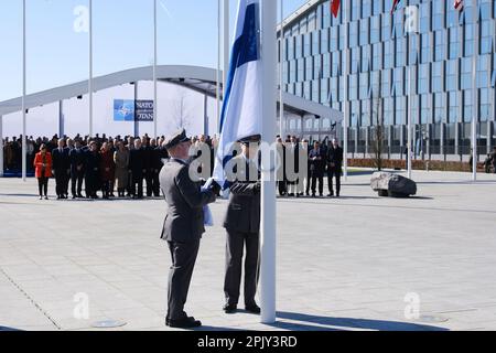 Brussels, Belgium. 04th Apr, 2023. Finnish military personnel install the Finnish national flag at the NATO Headquarters in Brussels, Belgium on April 04, 2023. Credit: ALEXANDROS MICHAILIDIS/Alamy Live News Stock Photo