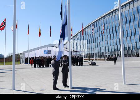 Brussels, Belgium. 04th Apr, 2023. Finnish military personnel install the Finnish national flag at the NATO Headquarters in Brussels, Belgium on April 04, 2023. Credit: ALEXANDROS MICHAILIDIS/Alamy Live News Stock Photo