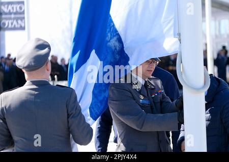 Brussels, Belgium. 04th Apr, 2023. Finnish military personnel install the Finnish national flag at the NATO Headquarters in Brussels, Belgium on April 04, 2023. Credit: ALEXANDROS MICHAILIDIS/Alamy Live News Stock Photo