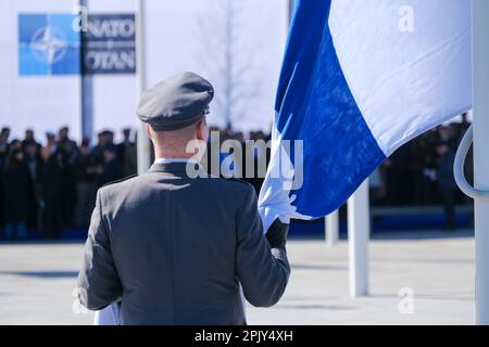 Brussels, Belgium. 04th Apr, 2023. Finnish military personnel install the Finnish national flag at the NATO Headquarters in Brussels, Belgium on April 04, 2023. Credit: ALEXANDROS MICHAILIDIS/Alamy Live News Stock Photo