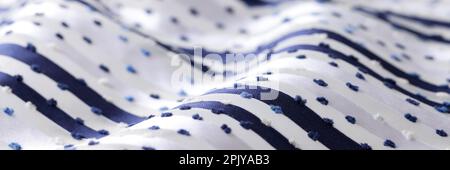 White fabric with dark stripes and dots Stock Photo