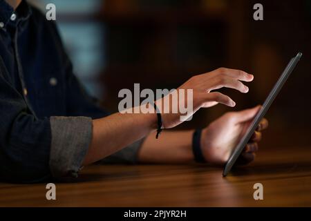 Unrecognizable man touching digital tablet screen, cropped Stock Photo