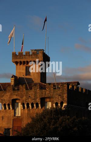 Château Grimaldi in Haut de Cagnes town square (Cagnes sur Mer, France) seen with a golden glow at sunsrise Stock Photo