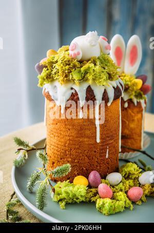 Paska - the Easter Eve sweet bread with icing decorated with eatable "moss" still life. Popular dessert during Eastern Orthodox Easter Holiday. Old cu Stock Photo
