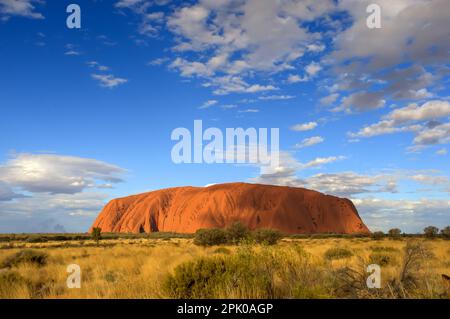 Uluru (Ayers Rock) is a giant monolith of red sandstone located in the Red Centre of Australia Stock Photo