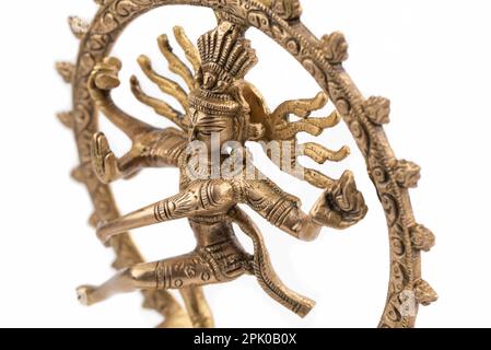 Closeup of Shiva Nataraj or Dancing Shiva brass statue isolated on white background Stock Photo