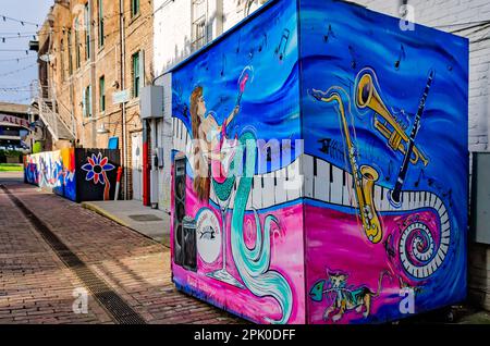 Fishbone Alley is pictured, April 2, 2023, in Gulfport, Mississippi. The brick alley, which is filled with graffiti and art by local artists, has beco Stock Photo