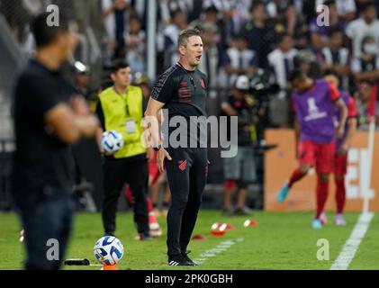 Coach Paulo Autori of Brazil's Athletico Paranaense scratches his head  during a Copa Libertadores round of sixteen second leg soccer match against  Argentina's River Plate at the Libertadores de America stadium in