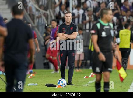 Coach Paulo Autori of Brazil's Athletico Paranaense scratches his head  during a Copa Libertadores round of sixteen second leg soccer match against  Argentina's River Plate at the Libertadores de America stadium in