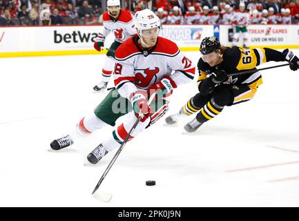 Detroit Red Wings goaltender Alex Nedeljkovic (39) stops a shot as  Pittsburgh Penguins center Mikael Granlund (64) looks for a rebound in the  first period of an NHL hockey game Tuesday, March 28, 2023, in Detroit. (AP  Photo/Paul Sancya Stock Photo