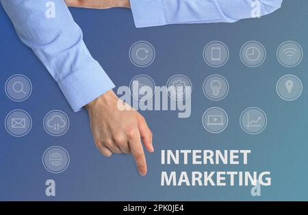 Internet marketing. Different icons and businessman on light blue background, top view Stock Photo