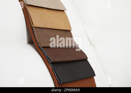 Catalog of colorful fabric samples on white background, closeup Stock Photo