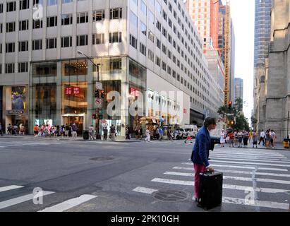 A man waiting for a taxi on the 5th Ave in midtown Manhattan, New York City, USA. Stock Photo