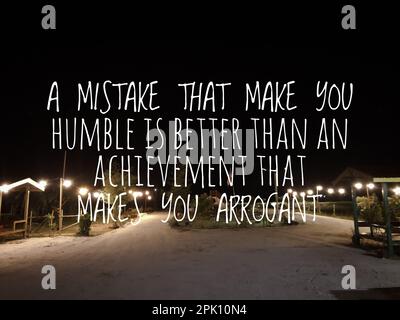 Motivational and inspirational quote with phrase A MISTAKE THAT MAKE YOU HUMBLE IS BETTER THAN AN ACHIEVEMENT THAT MAKES YOU ARROGANT Stock Photo
