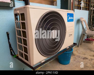 Klang, Malaysia: October 26, 2021- Air conditioner on wall outside the house Stock Photo