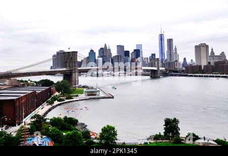 A view of the East River, The Brooklyn bridge and Manhattan seen from the Manhattan bridge in New York CIty, USA. Stock Photo