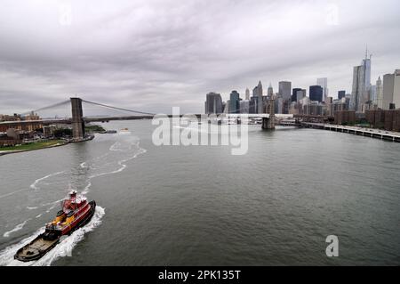 A view of the East River, The Brooklyn bridge and Manhattan seen from the Manhattan bridge in New York CIty, USA. Stock Photo