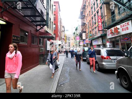 Tourist walking on Pell street in Chinatown in Manhattan, New York City, NY, USA. Stock Photo