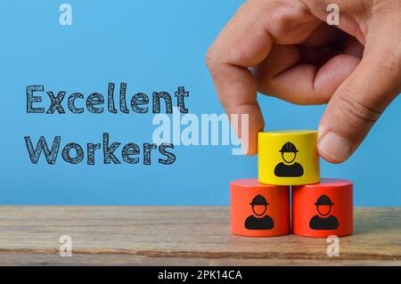 Wooden blocks with workers symbol. Excellent workers concept Stock Photo