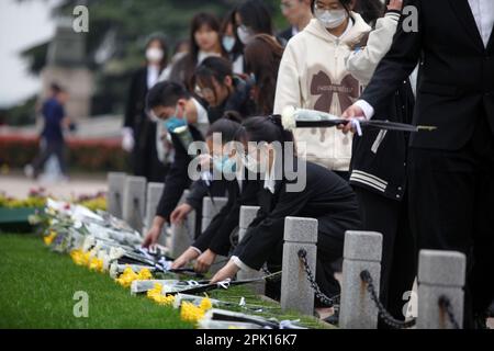 NANJING, CHINA - APRIL 5, 2023 - People present flowers to revolutionary martyrs at Yuhuatai Martyrs Cemetery in Nanjing, East China's Jiangsu Provinc Stock Photo