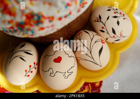 Easter kulich and decorated eggs on cloth, top view Stock Photo