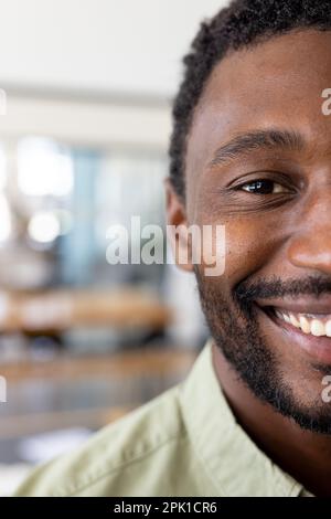 Portrait of happy casual african american businessman looking at camera in modern office Stock Photo