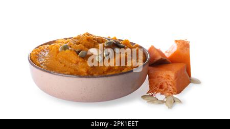 Delicious vegetable puree with pumpkin pieces and seeds on white background. Healthy food Stock Photo