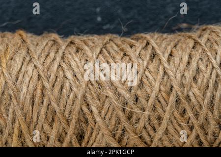 Natural jute twine skein, close-up. Spool of linen rope texture on the background Stock Photo