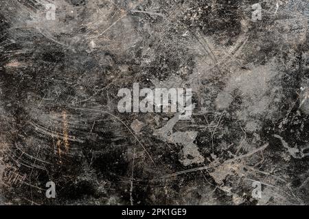 Grunge old black metal background or texture with scratches and cracks, close up, top view Stock Photo