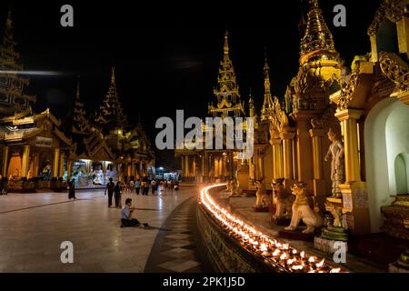 Yangon, Myanmar. 05th Apr, 2023. Someone prays at Shwedagon Pagoda in Yangon. Daily life during the deadly civil war in Myanmar. On February 1, 2021, the military junta government (Tatmadaw) seized power by coup, jailing the democratically-elected government and plunging the country into an ongoing humanitarian crisis. Credit: Matt Hunt/Neato/Alamy Live News Stock Photo