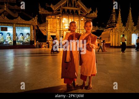 Yangon, Myanmar. 05th Apr, 2023. Young monks and nuns pose for a portrait while praying at Shwedagon Pagoda in Yangon.Daily life during the deadly civil war in Myanmar. On February 1, 2021, the military junta government (Tatmadaw) seized power by coup, jailing the democratically-elected government and plunging the country into an ongoing humanitarian crisis. Credit: Matt Hunt/Neato/Alamy Live News Stock Photo
