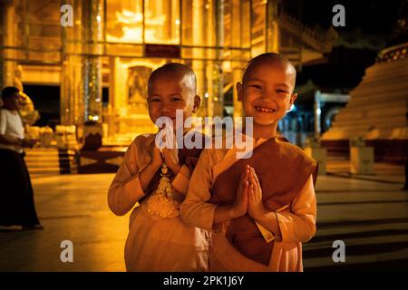 Yangon, Myanmar. 05th Apr, 2023. A young nun and monk smile for a portrait at Shwedagon Pagoda in Yangon. Daily life during the deadly civil war in Myanmar. On February 1, 2021, the military junta government (Tatmadaw) seized power by coup, jailing the democratically-elected government and plunging the country into an ongoing humanitarian crisis. Credit: Matt Hunt/Neato/Alamy Live News Stock Photo