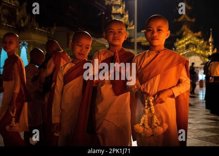 Yangon, Myanmar. 05th Apr, 2023. Young monks and nuns pose for a portrait while praying at Shwedagon Pagoda in Yangon. Daily life during the deadly civil war in Myanmar. On February 1, 2021, the military junta government (Tatmadaw) seized power by coup, jailing the democratically-elected government and plunging the country into an ongoing humanitarian crisis. Credit: Matt Hunt/Neato/Alamy Live News Stock Photo